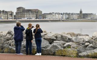 Bird spotting on Morecambe jetty Photo Credit Ernest Cook Trust