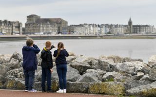 Bird spotting on Morecambe jetty Photo Credit Ernest Cook Trust
