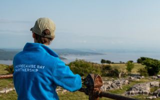 MBP staff looking out over Morecambe Bay from Hampsfell Robin Zahler