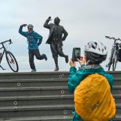 Cyclists at the Eric Morecambe Statue at Morecambe Prom Wildey Media